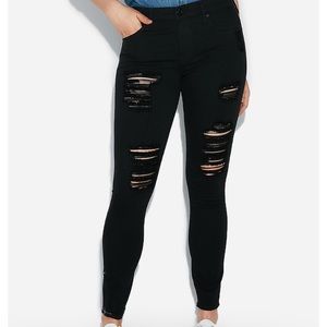 Distressed black skinny jeans/leggings